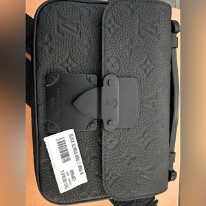 Authentic Louis Vuitton S lock cross body bag for men.